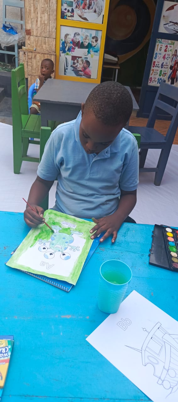 A student focused on a creative learning activity