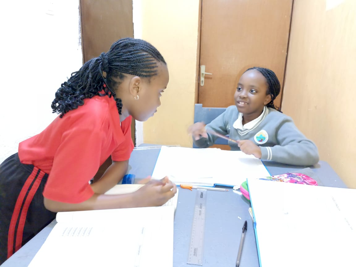 Two students working together at a desk