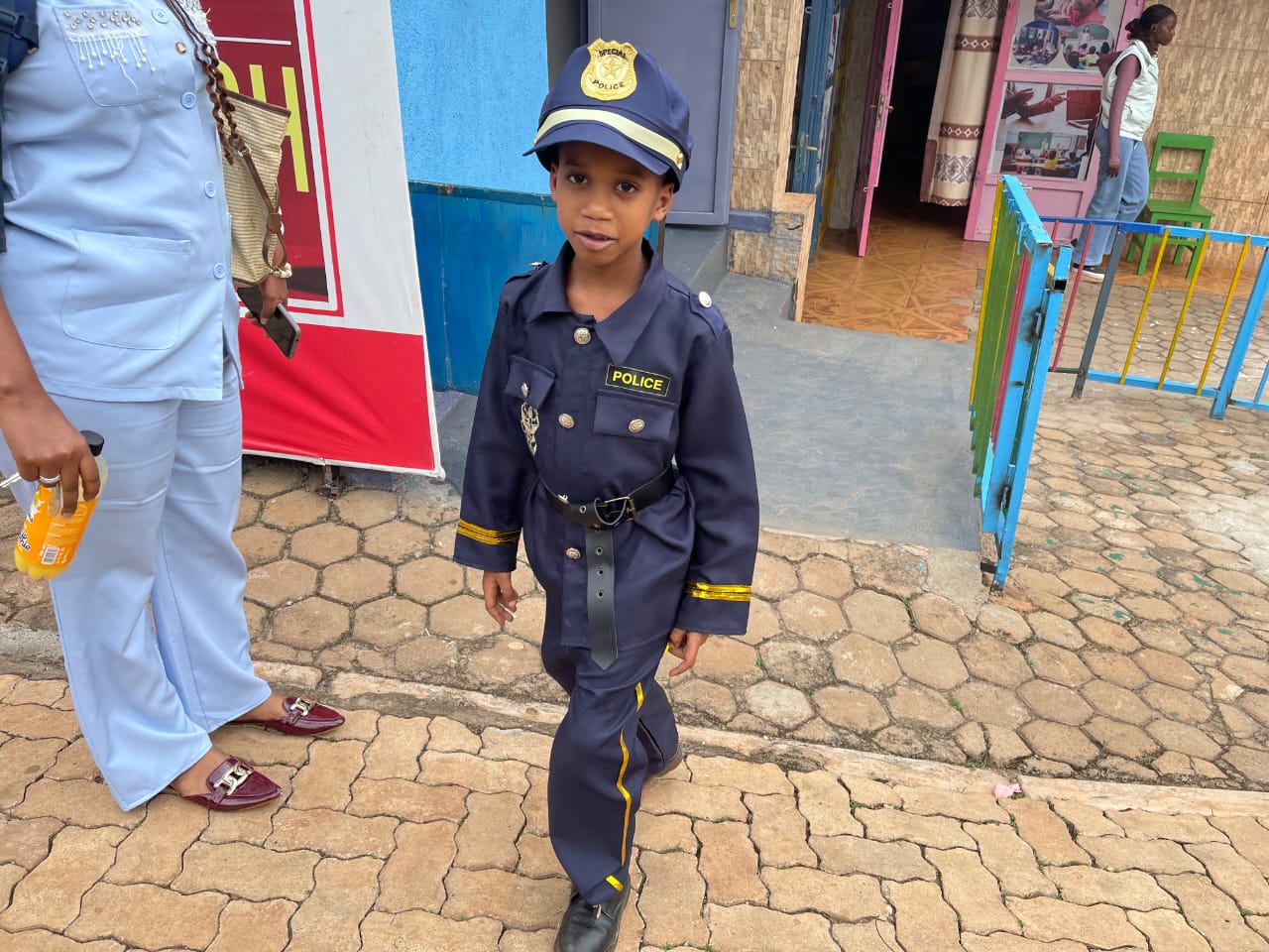 Child dressed up as a police officer for career day