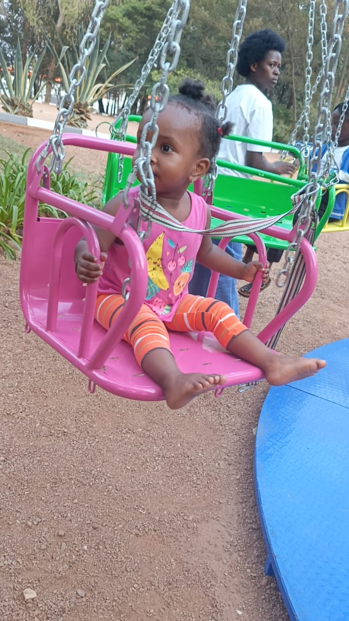 A child enjoying a sunny day out at the park