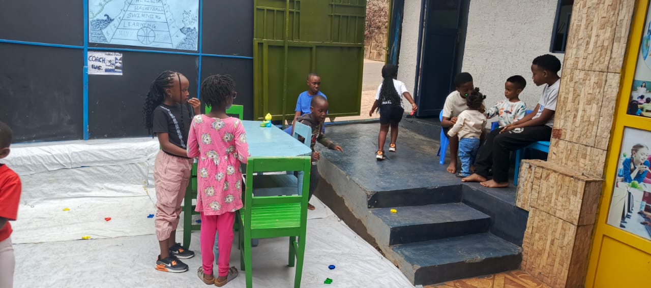 Children playing together in the creche courtyard